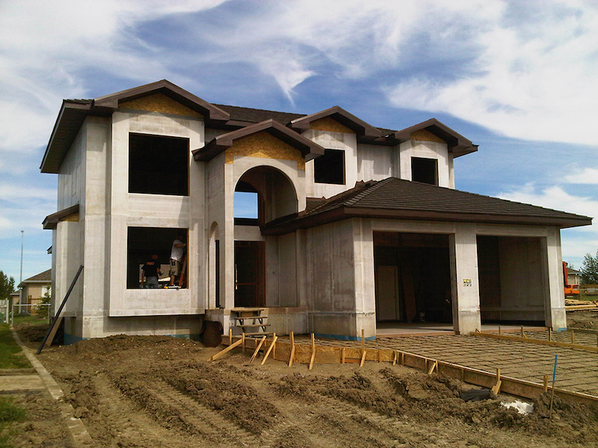 PSI Product Logo: Building home with insulated panels